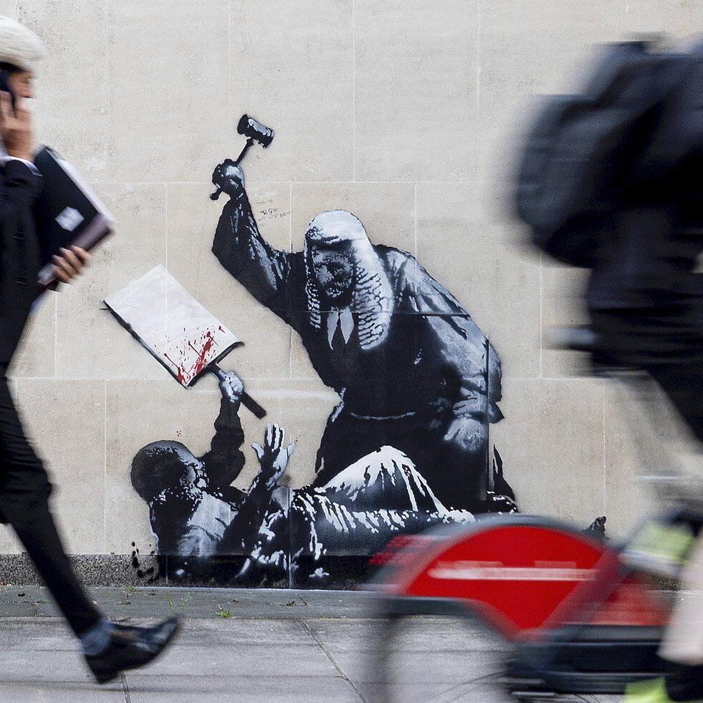 Banksy mural of a judge beating a protester is scrubbed from London court